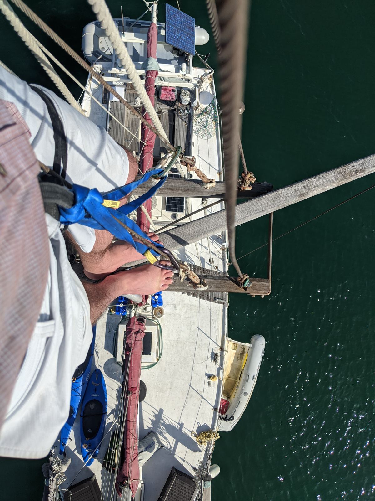 Looking straight down from Windance's crow's nest to her deck and red-wrapped boom