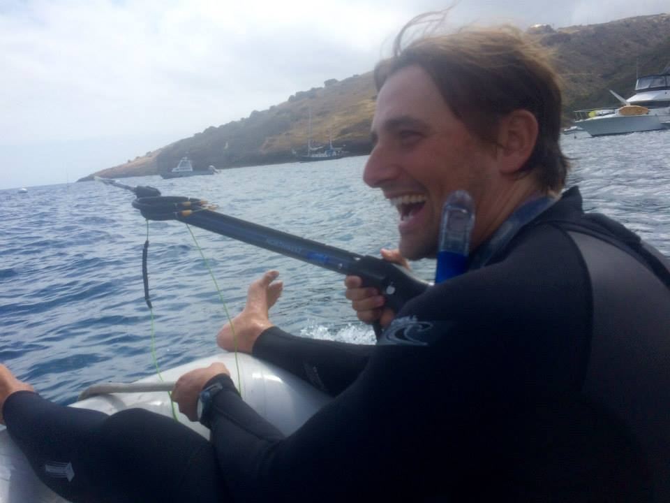 Laughing on a dinghy ride off Catalina in a wetsuit